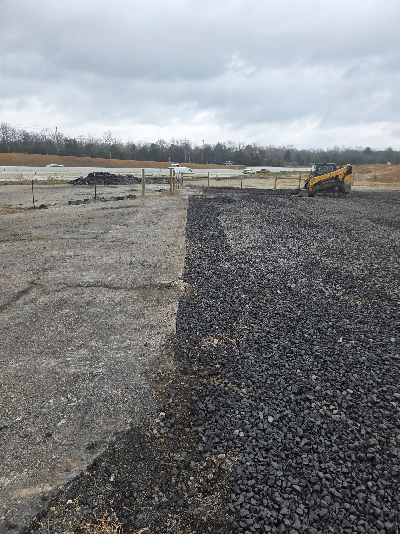 Closer view of the gravel tie-in at the asphalt edge.