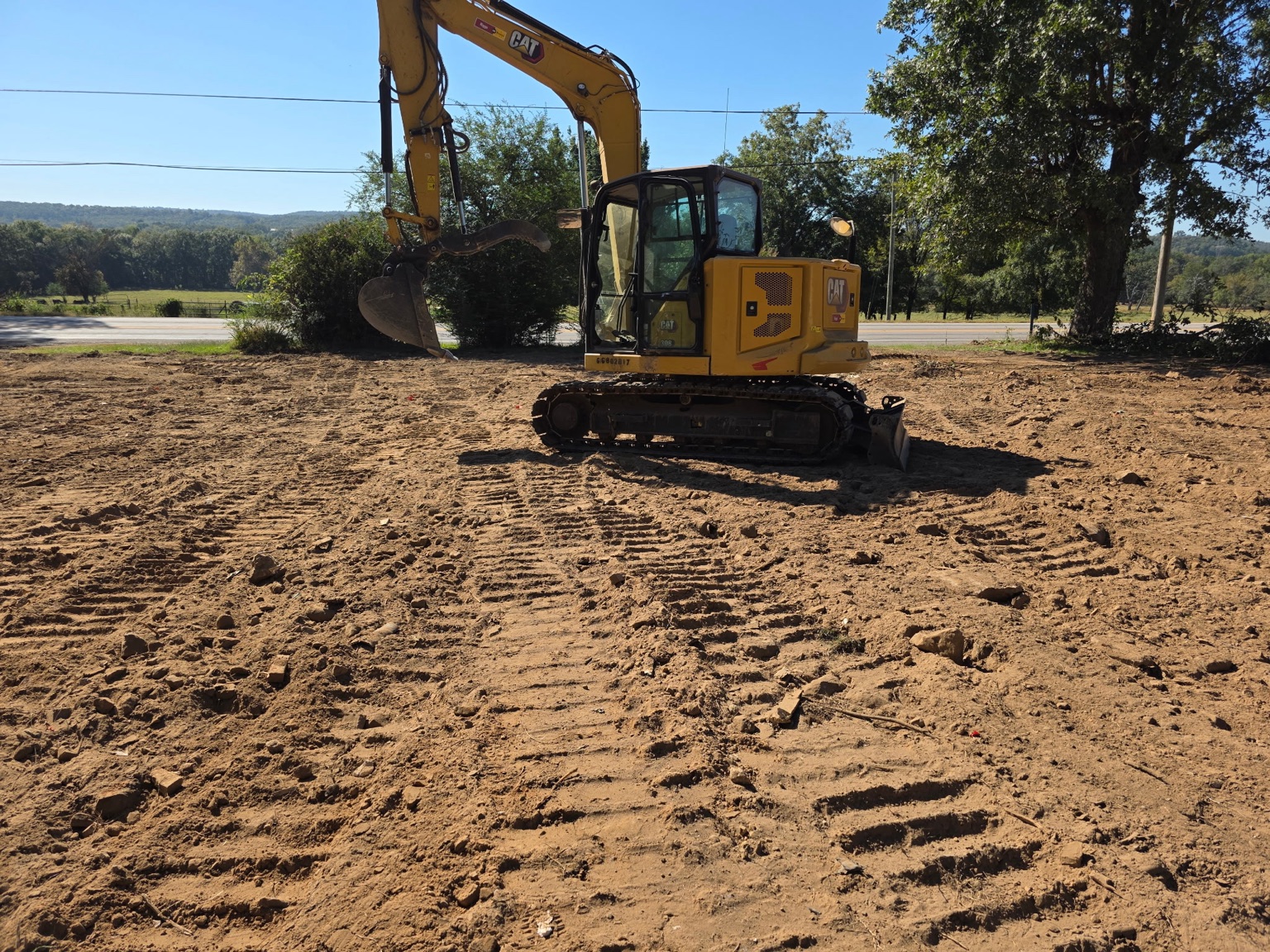 Meyers excavator in a rough grading work area in Conway